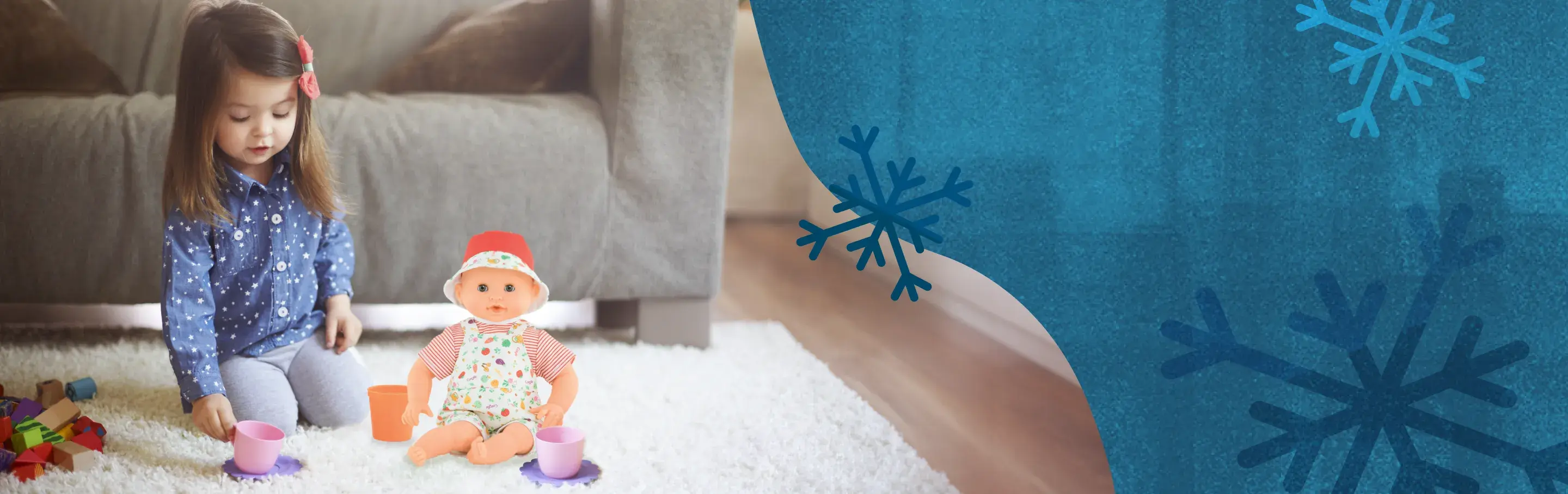 Girl playing with a doll while sitting on a floor in front of a sofa